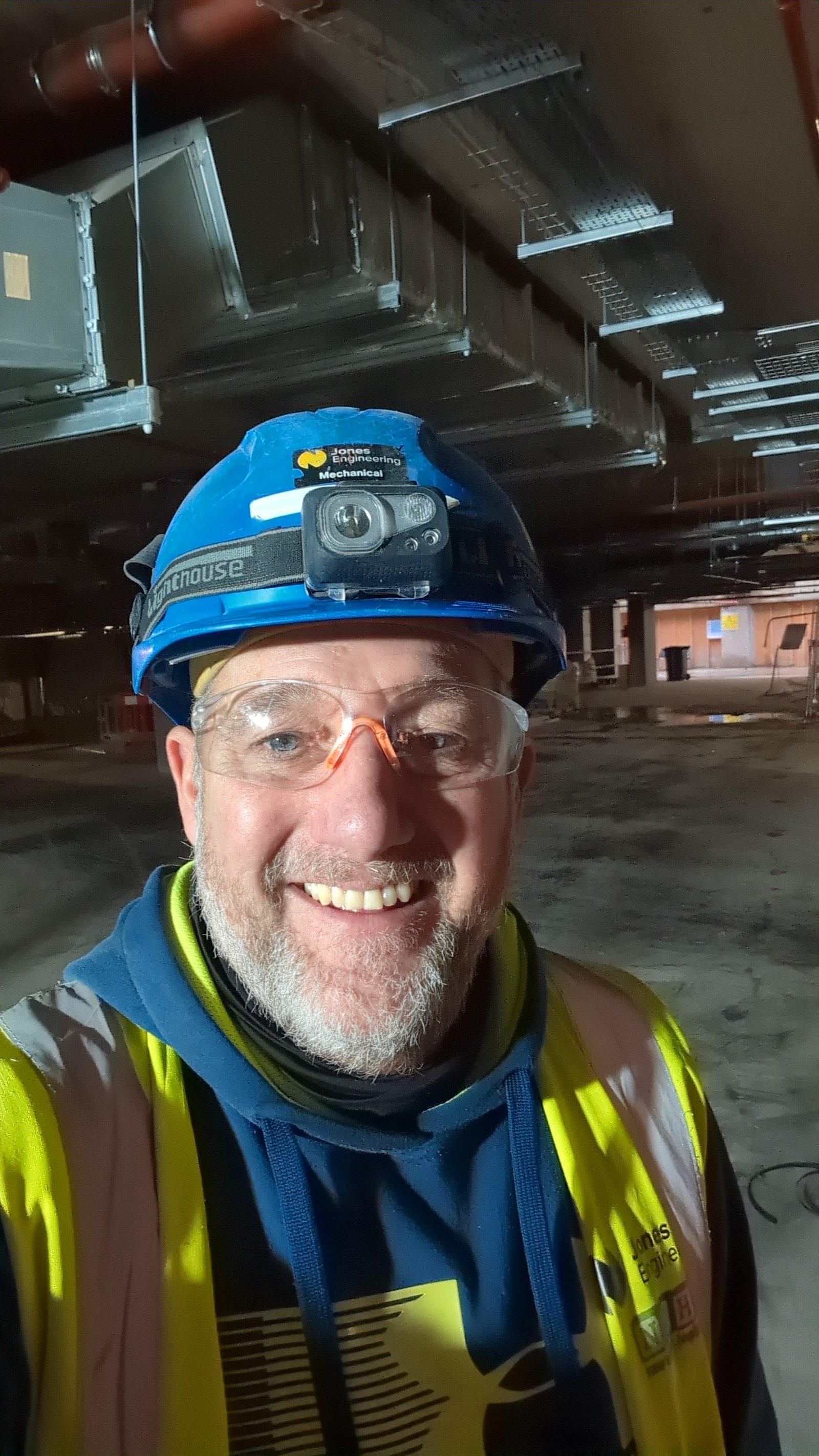 David Peck on site — head torch, working hours after hours